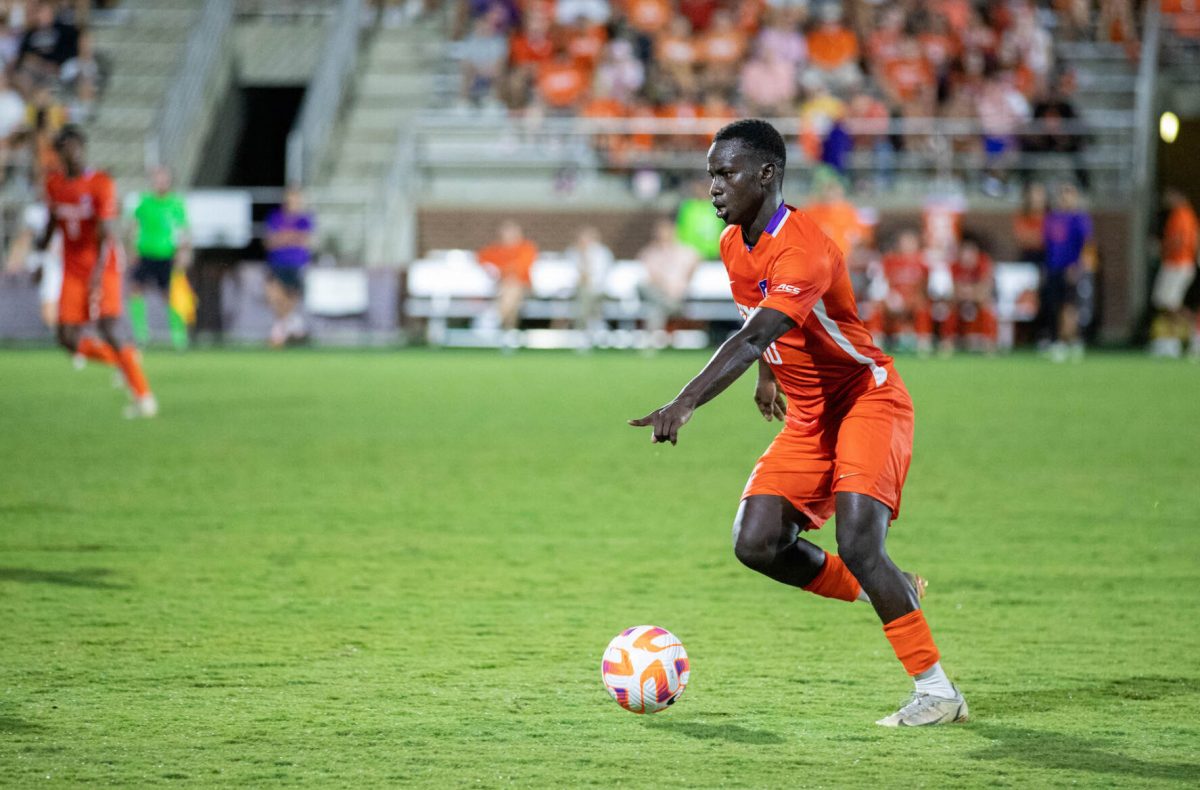 Clemson mens soccer midfielder Ousmane Sylla (No. 10) dribbles the ball in the Tigers 2022 season opener against Indiana at Historic Riggs Field on Friday, Aug. 26.