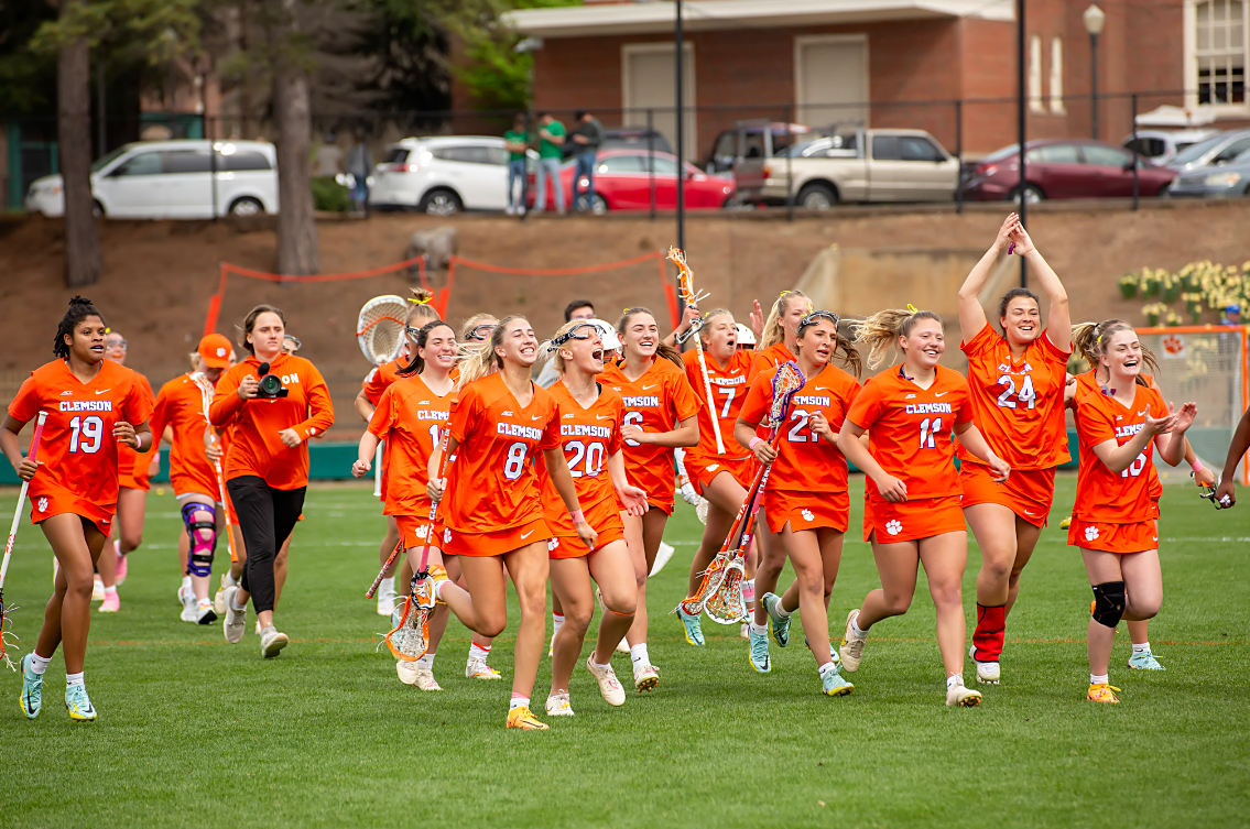 The Clemson womens lacrosse team runs off the field in celebration after the final whistle in a 11-10 upset over No. 13 Duke. 