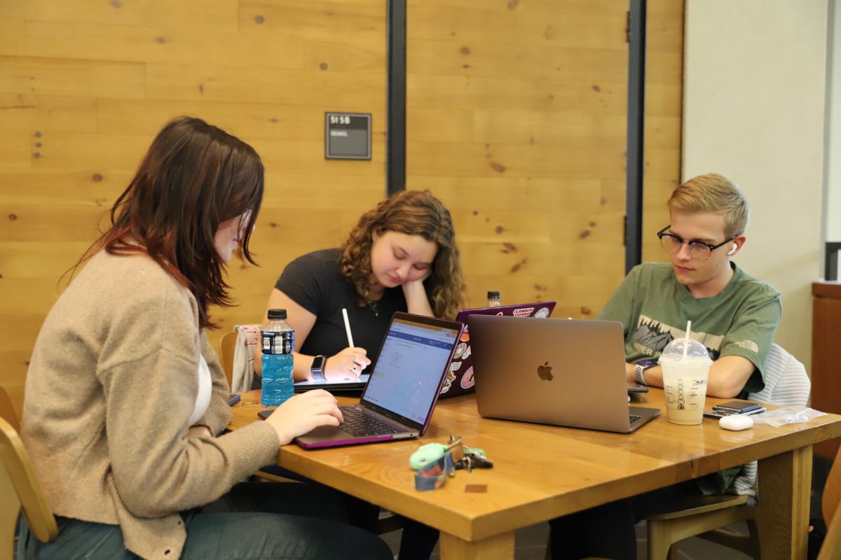 Students studying at the Starbucks in Cooper Library.