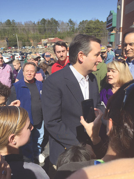Sen. Ted Cruz (R-Tex., bottom) speaks to a crowd outside of Seneca Family Restaurant on Wednesday. 