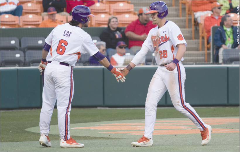 Freshman+outfielder+Seth+Beer+%2828%29+celebrates+with+his+teammate+Andrew+Cox+%286%29+after+scoring+a+run+against+Wofford.+The+Tigers+won+the+game+7-0+at+Doug+Kingsmore+Stadium.