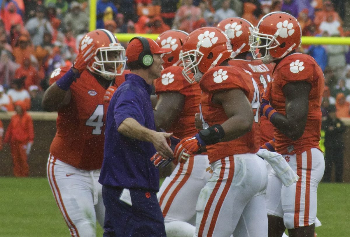 Defensive+Coordinator+Brent+Venables+gathers+with+his+team+on+the+field+against+Georgia+Tech.