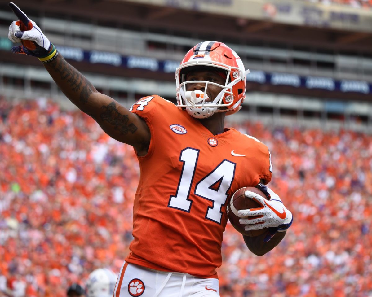 Junior Diondre Overton (14) celebrates after catching his first touchdown this season.