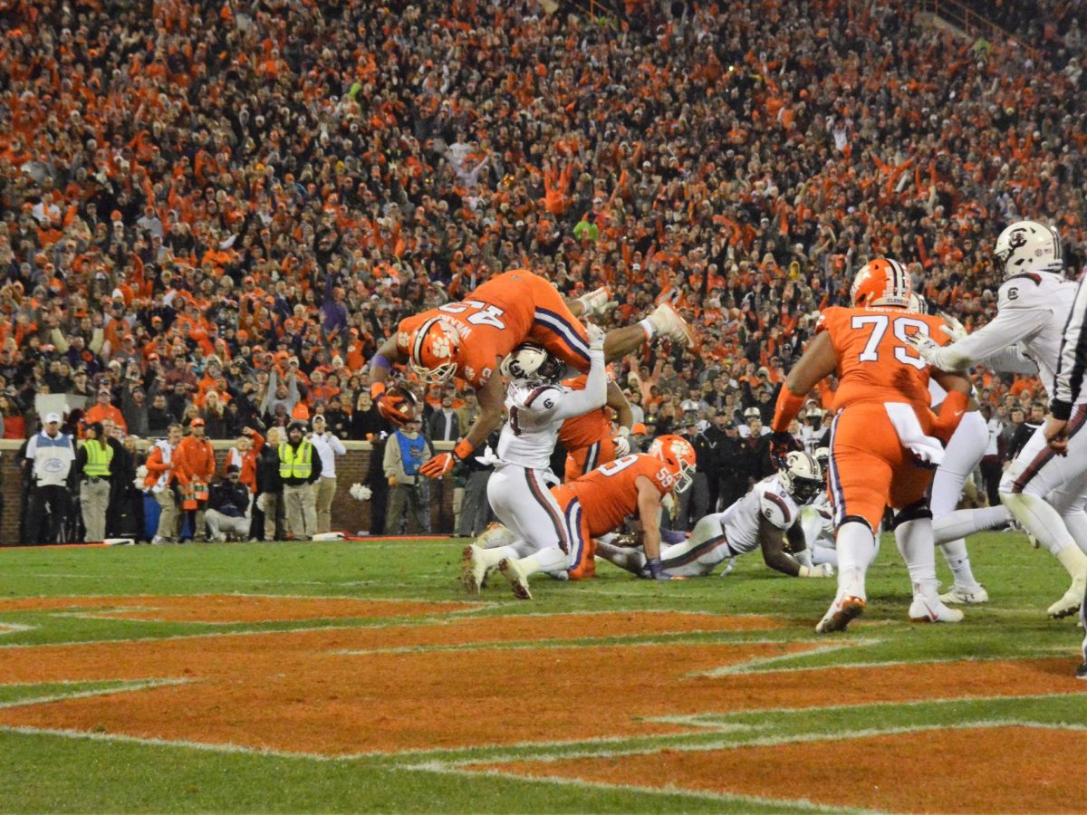 Christian Wilkins (42) jumps over South Carolina linebacker Sherrod Greene (44) to put the Tigers up 21-7 in the second quarter. It was Wilkins' second rushing touchdown of the year.