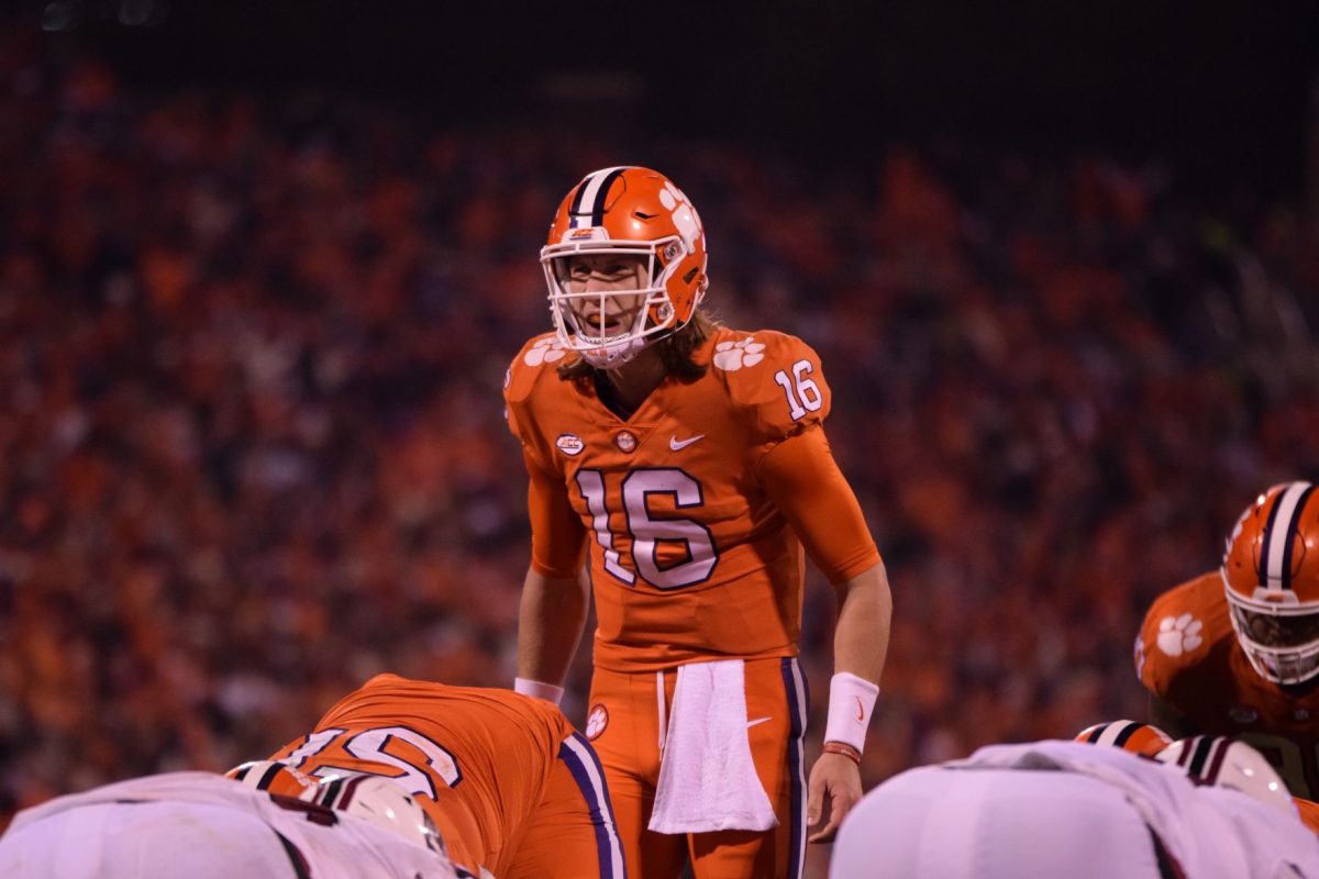 Trevor Lawrence (16) calls out an audible. Lawrence threw for more yards than any other Clemson quarterback in the history of the Clemson-South Carolina rivalry. The Tigers defeated the Gamecocks 56-35 on Saturday