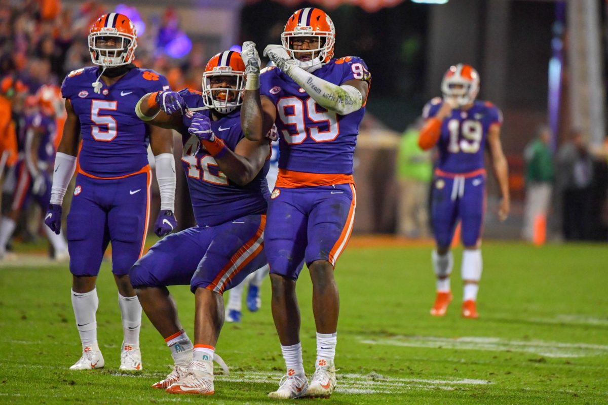 Shaq Smith (5), Christian Wilkins (42), Clelin Ferrell (99) celebrate one of the Tigers four sacks against Duke. 