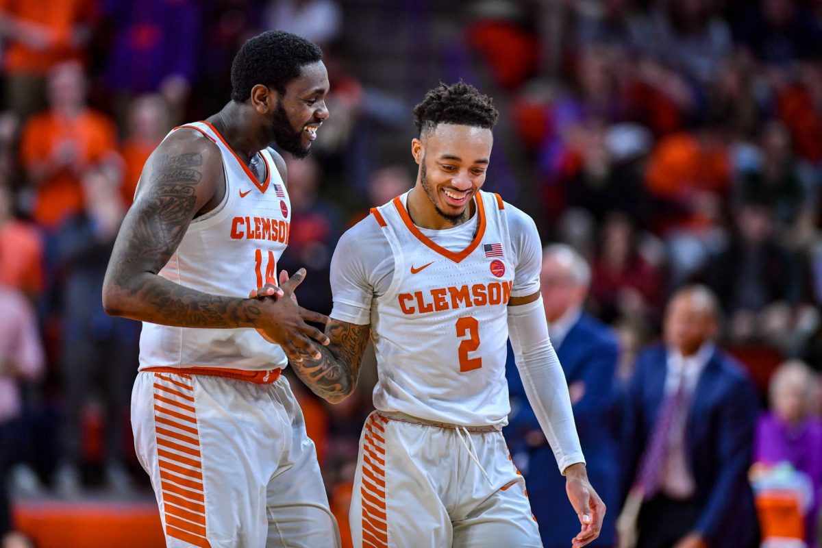 Elijah Thomas (14) and Marcquise Reed (2) share a lighthearted moment. Reed finishes his career as the 12th leading scorer and the most accurate free-throw shooter in Clemson history while Thomas' 1.95 blocks per game rank fourth all-time in the history of the program.&#160;