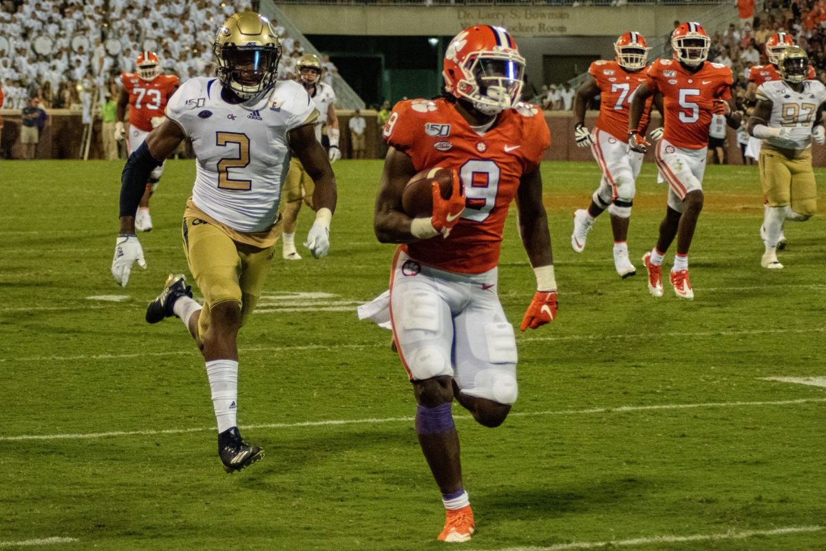 Travis Etienne (9) races down sideline in Clemson's 52-14 win over Georgia Tech.&#160;