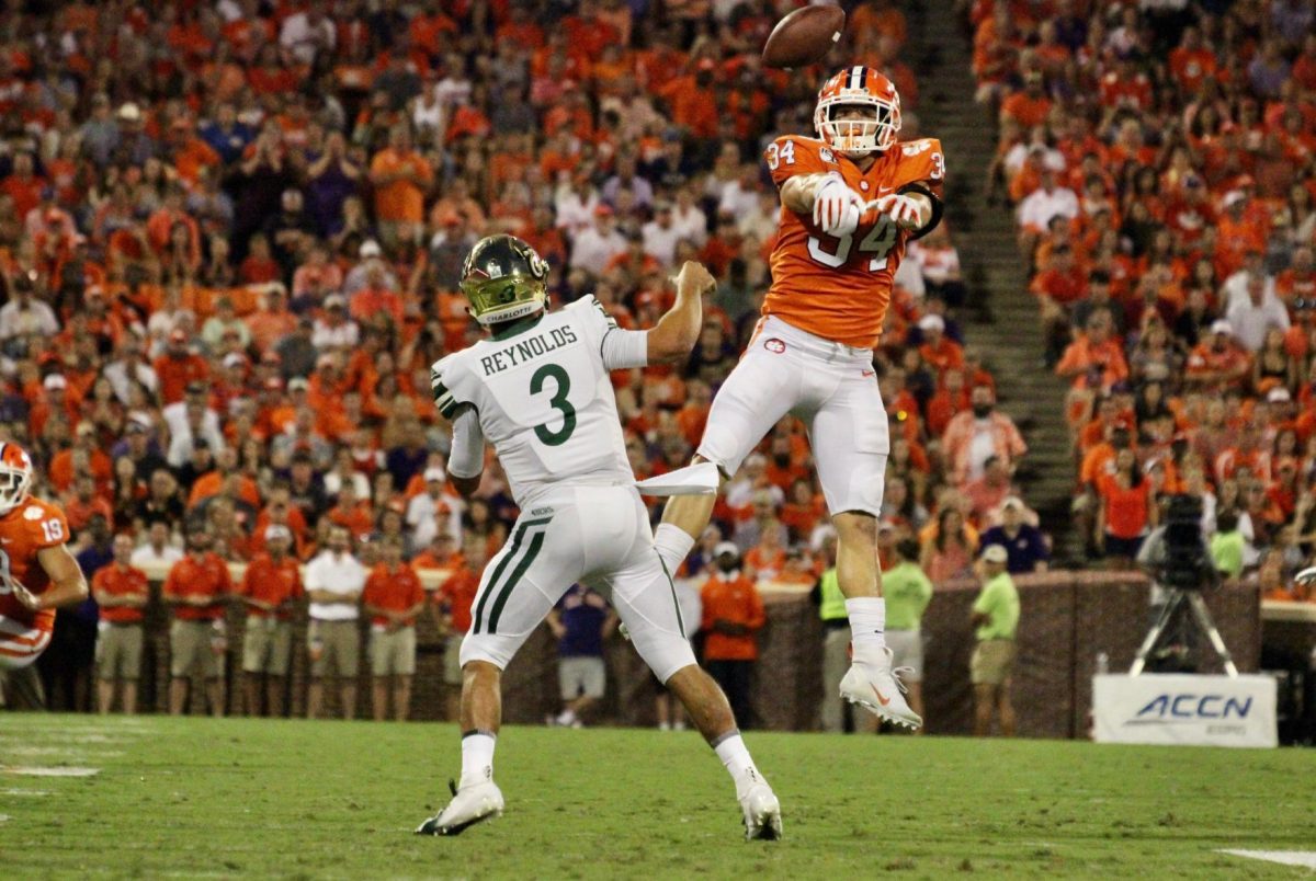 Clemson defensive end Logan Rudolph (34) swats a pass in a 52-10 victory over Charlotte.