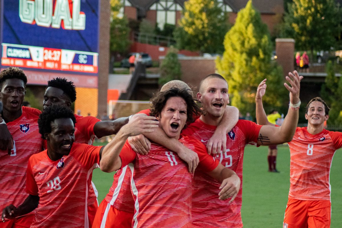 The Clemson men's soccer team celebrates after taking the lead against South Carolina.