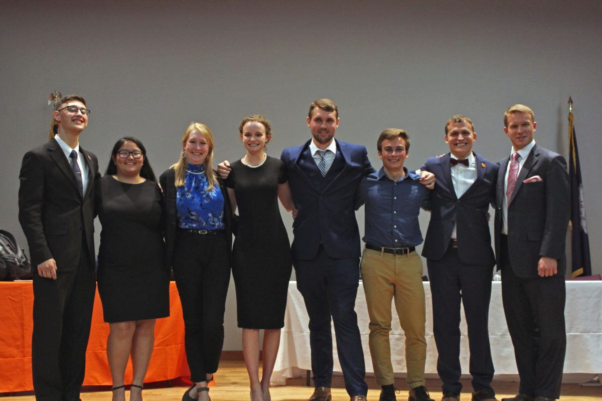 Pictured here are the representatives of College Democrats (the left four individuals) and College Republicans (the right four individuals).