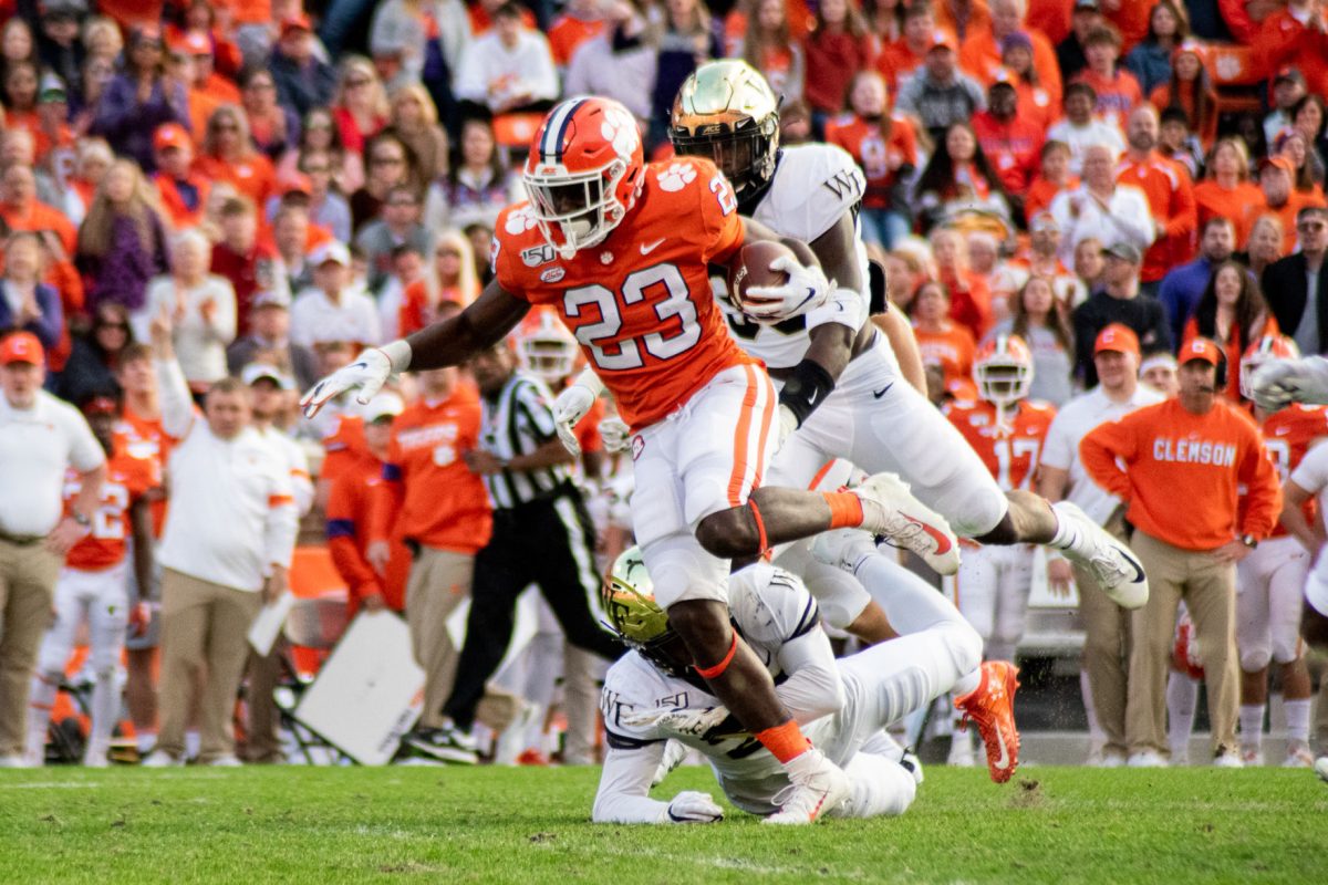 Clemson running back Lyn-J Dixon (23) breaks a tackle against Wake Forest.&#160;