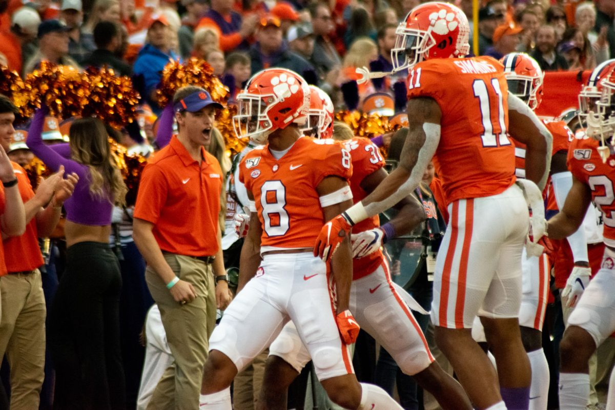 AJ Terrell (8) and Isaiah Simmons (11) celebrate after Terrell's interception against Wake Forest.&#160;