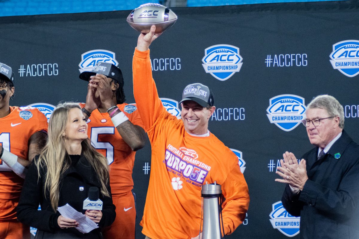 Clemson Head Coach Dabo Swinney celebrates Clemson's ACC Championship victory over the Virginia Cavaliers.