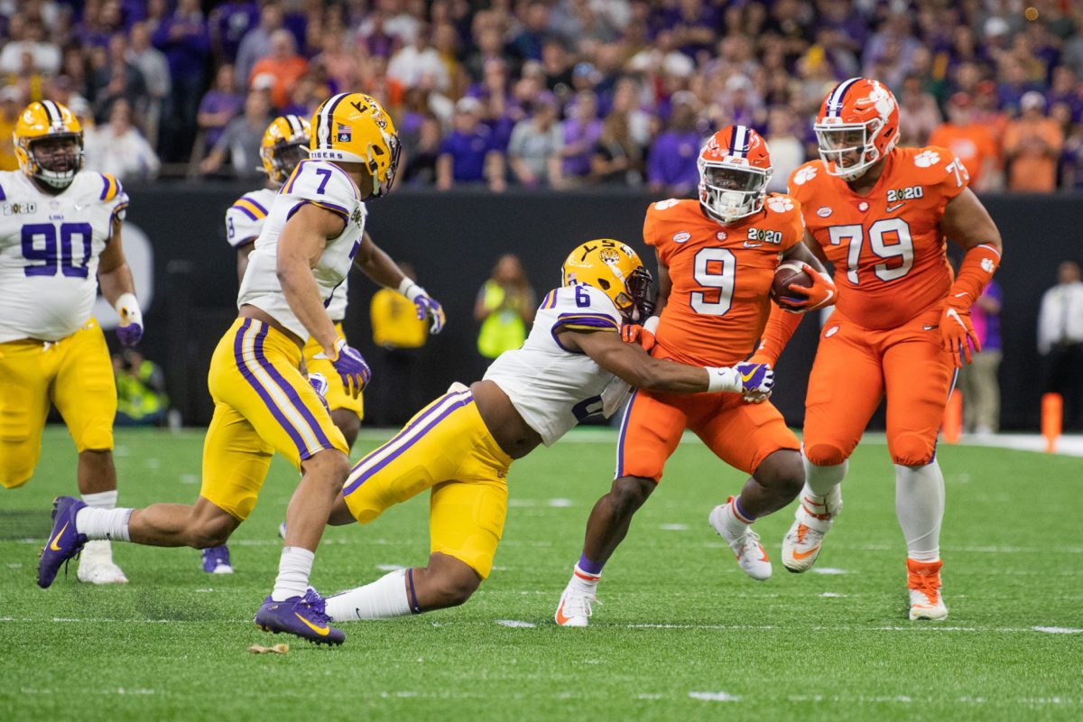 Travis Etienne (9) carries the ball against LSU in the 2020 College Football Playoff Championship Game.