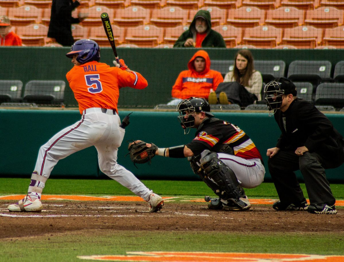 Now-junior third baseman Sam Hall (5) bats against VMI last season. Hall had a .257 batting average and a .365 on-base percentage last season. The Tigers open play Feb. 14 against Liberty University at Doug Kingsmore Stadium.