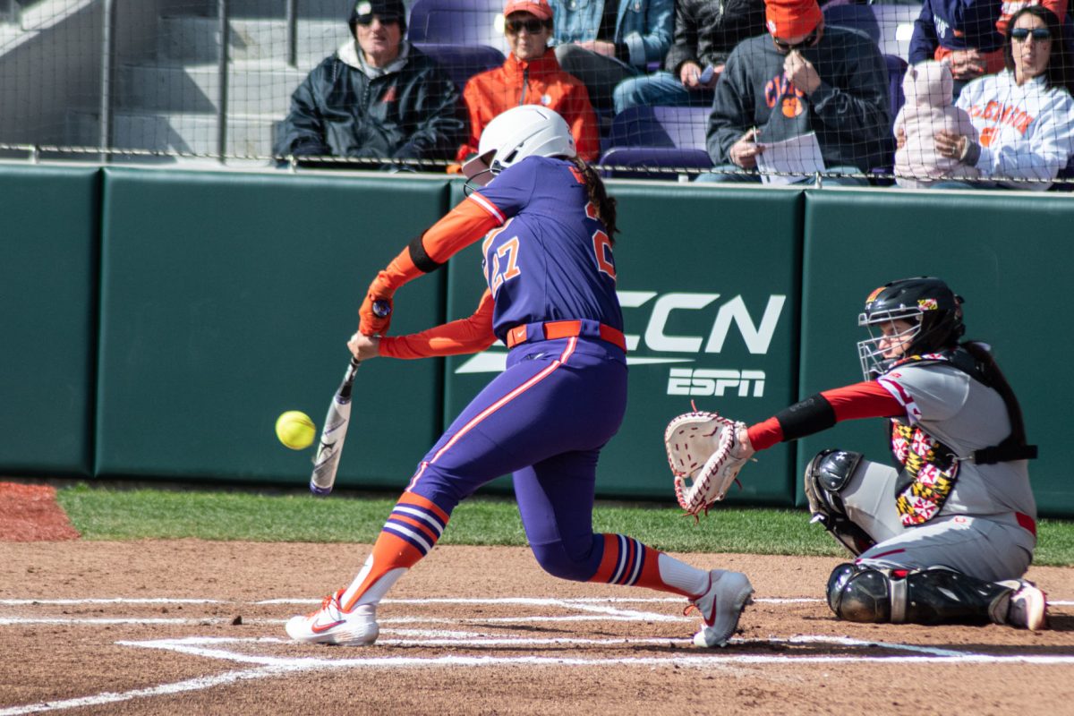 Junior Grace Mattimore (27) connects with a pitch during the team's Feb. 15 game against Maryland. Mattimore tallied four hits during the three-game sweep of Virginia this weekend.