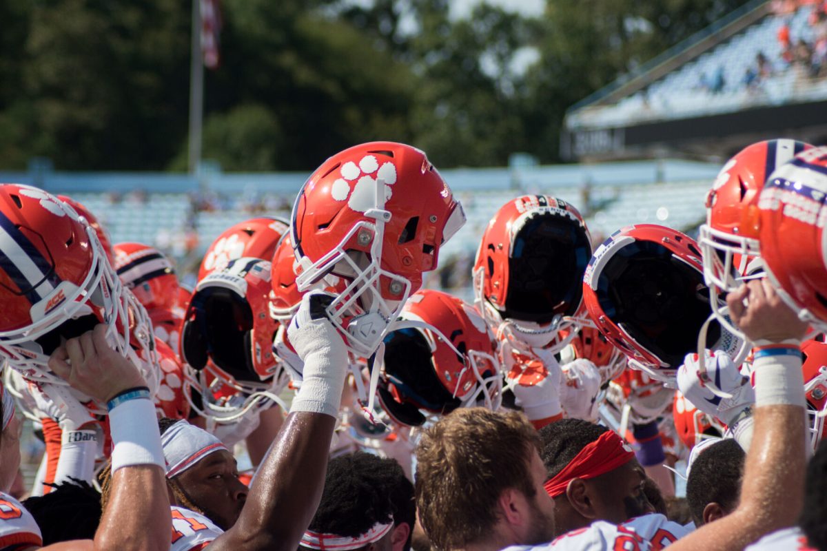 The Clemson Tigers raise their helmets prior to their 2019 game against the North Carolina Tar Heels. The Tigers nearly escaped defeat at the hands of the Tar Heels with a 21-20 win.