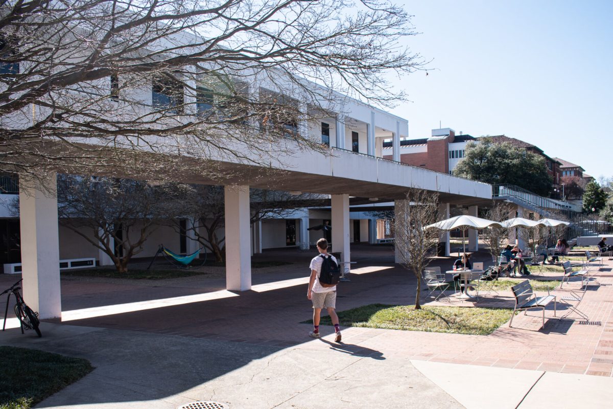 Students walk to class under library bridge on a sunny Clemson day.&#160;