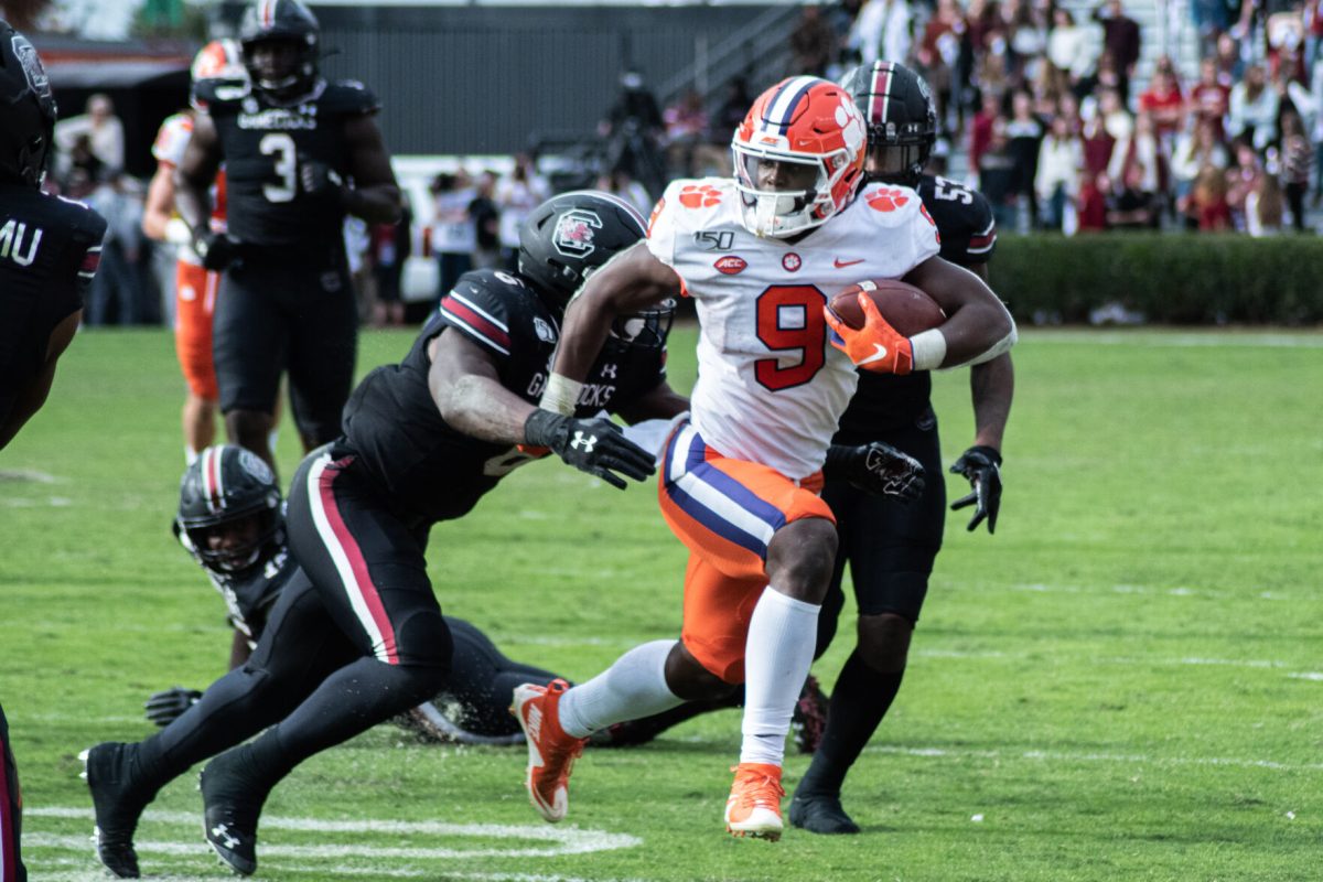 Clemson running back Travis Etienne (9) sheds a tackler during the 2019 Palmetto Bowl against South Carolina at Williams-Brice Stadium in Columbia, S.C. The Tigers and Gamecocks did not play for the first time since 1908 due to out-of-conference restrictions due to the Covid-19 pandemic.