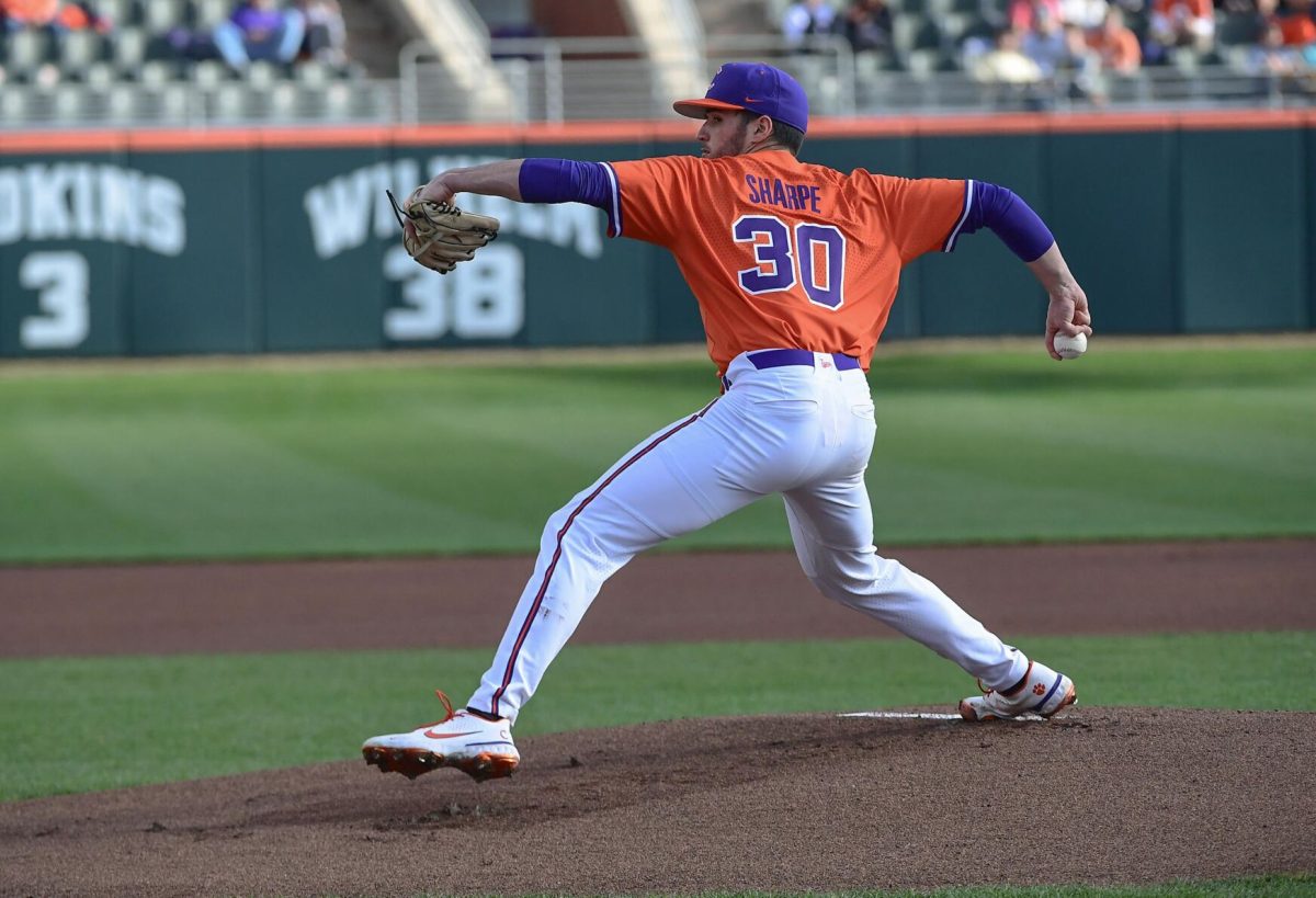 Clemson sophomore Davis Sharpe (30) pitches during the top first inning against the Cincinnati Bearcats at Doug Kingsmore Stadium in Clemson, S.C., Friday, Feb. 19, 2021. Sharpe threw five innings and allowed just one walk and one hit.