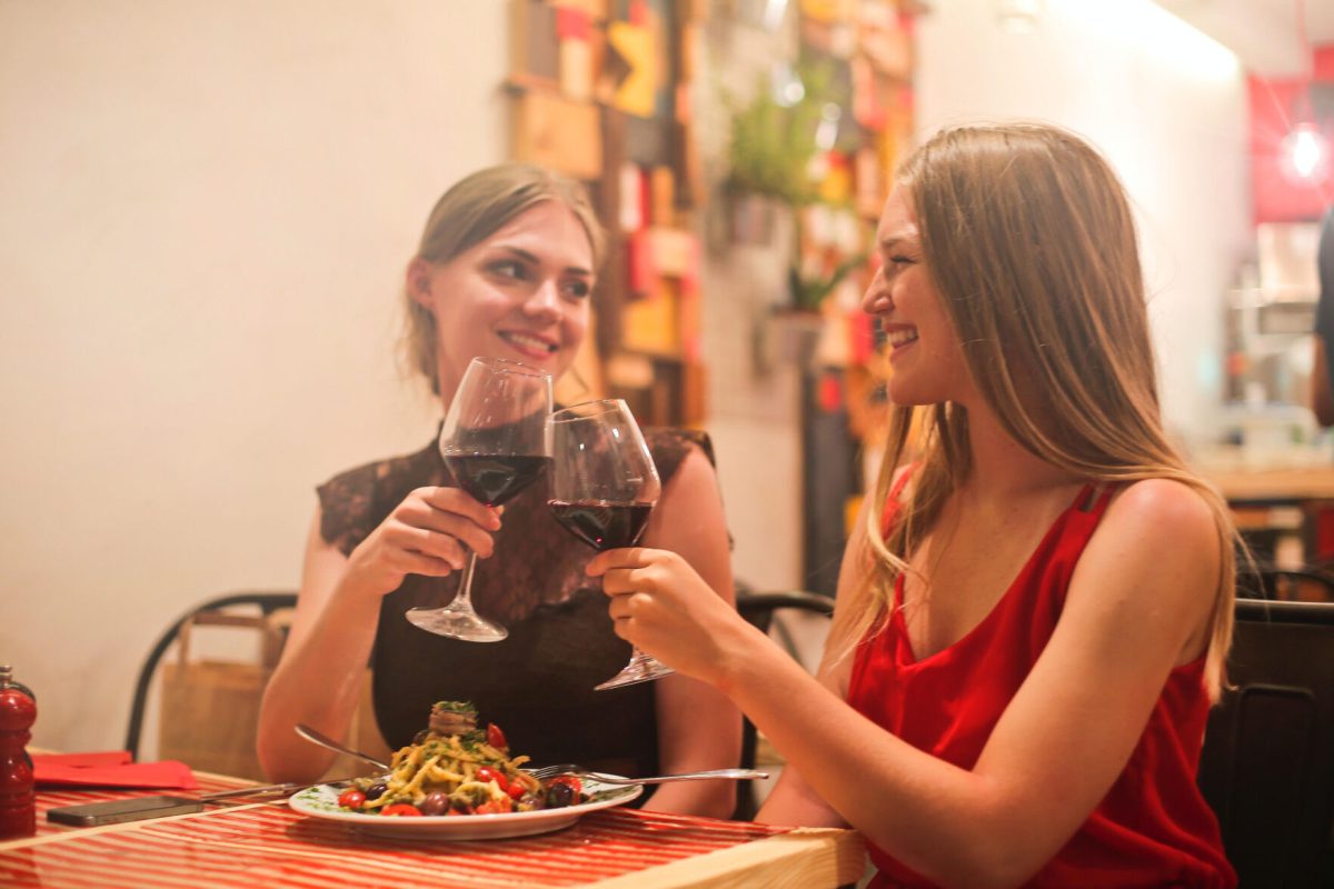 Two women enjoy a romantic dinner.&#160;