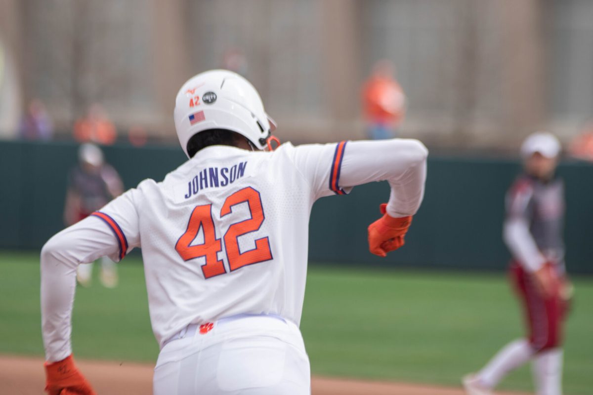 Redshirt freshman Morgan Johnson celebrates the first homerun of her collegiate career as she rounds first base during the fifth inning.