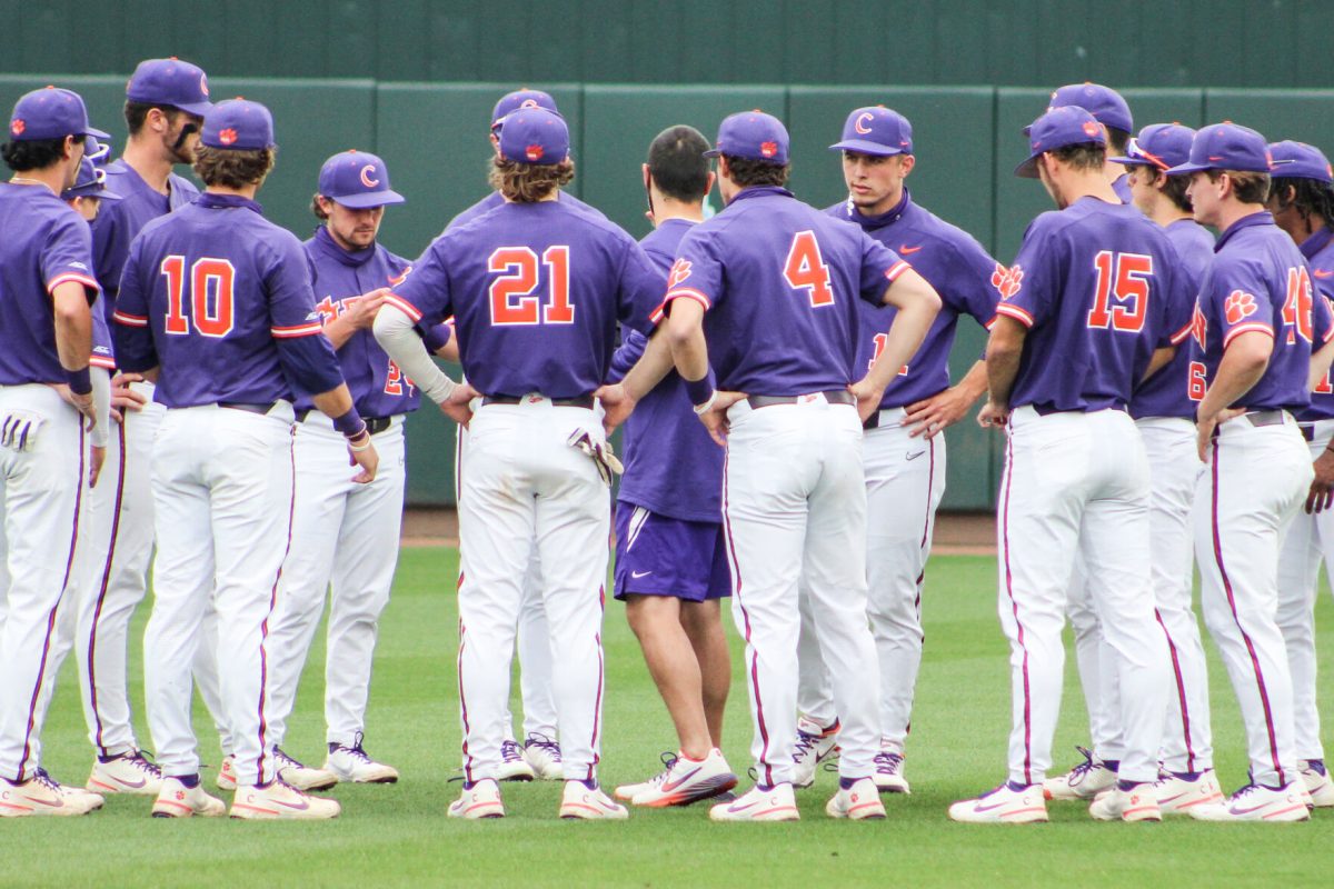 The Tigers huddle to discuss strategy before their March 13, 2021 game against the North Carolina Tar Heels in Chapel Hill, N.C. The Tar Heels took game two 5-4.