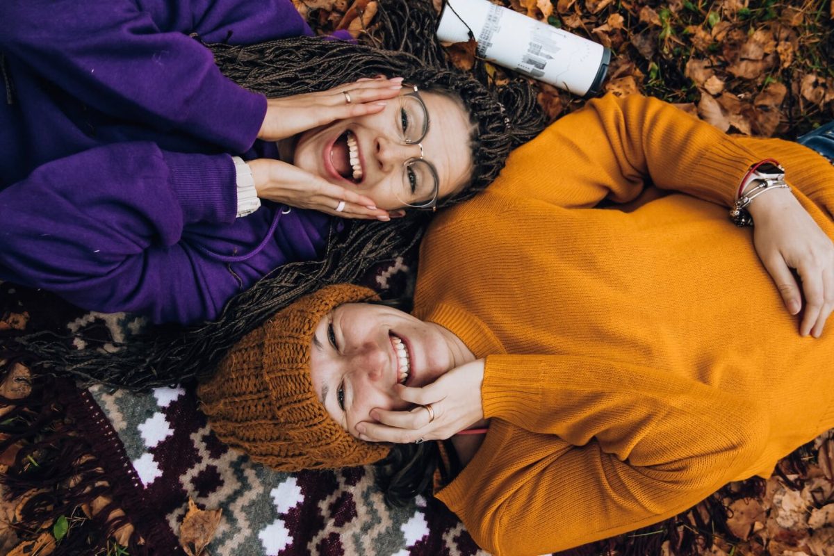 Two friends laugh as they hang out.&#160;