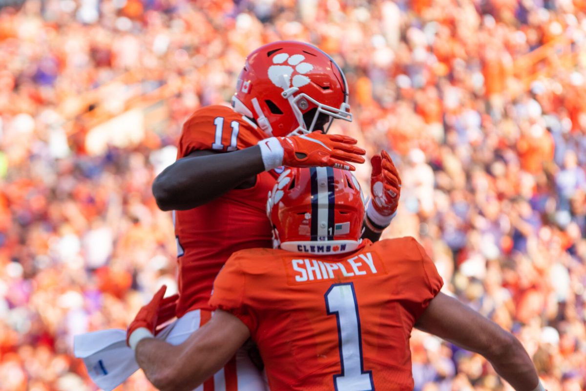 Running back Will Shipley (8) and wide receiver Ajou Ajou (11) celebrate in Memorial Stadium during a game against South Carolina State on Sept. 11, 2021.