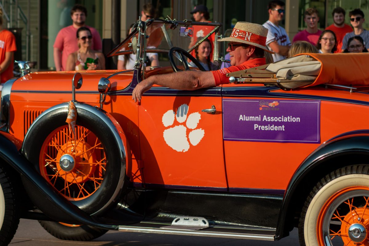 Gregg Morton, president of the Clemson Alumni Association, drove an antique car down the parade route on Friday.