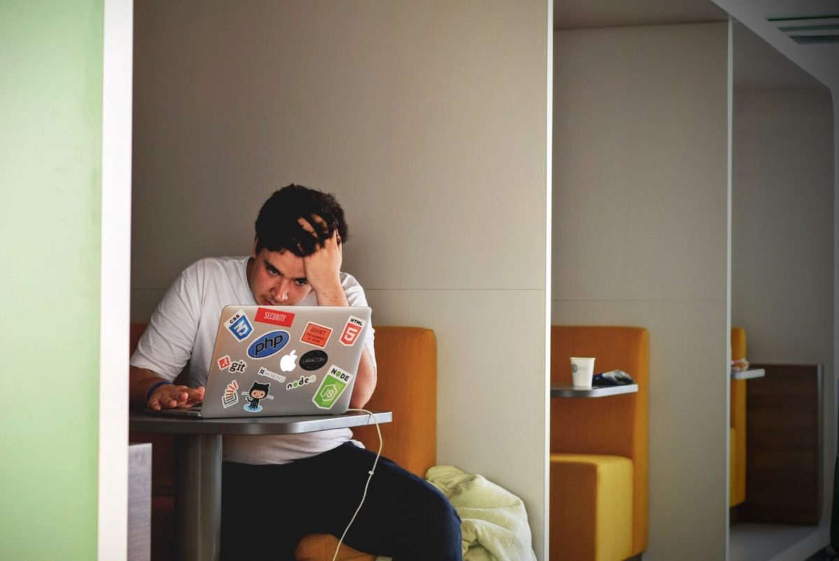 male student studying at a desk