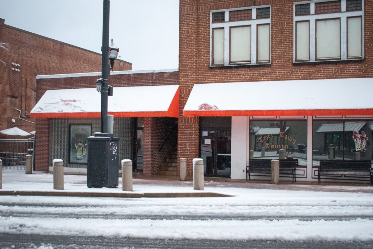Tiger Town Tavern sits along a snowy sidewalk on College Avenue in downtown Clemson early on the morning of Jan. 16, 2022.
