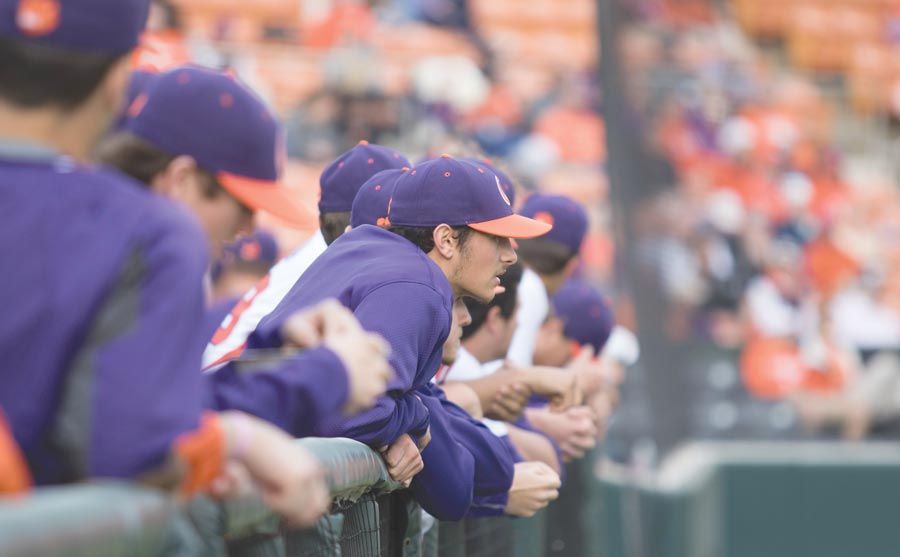 Clemson+baseball+team+gathers+in+the+dugout+during+a+game+at+Doug+Kingsmore+Stadium.