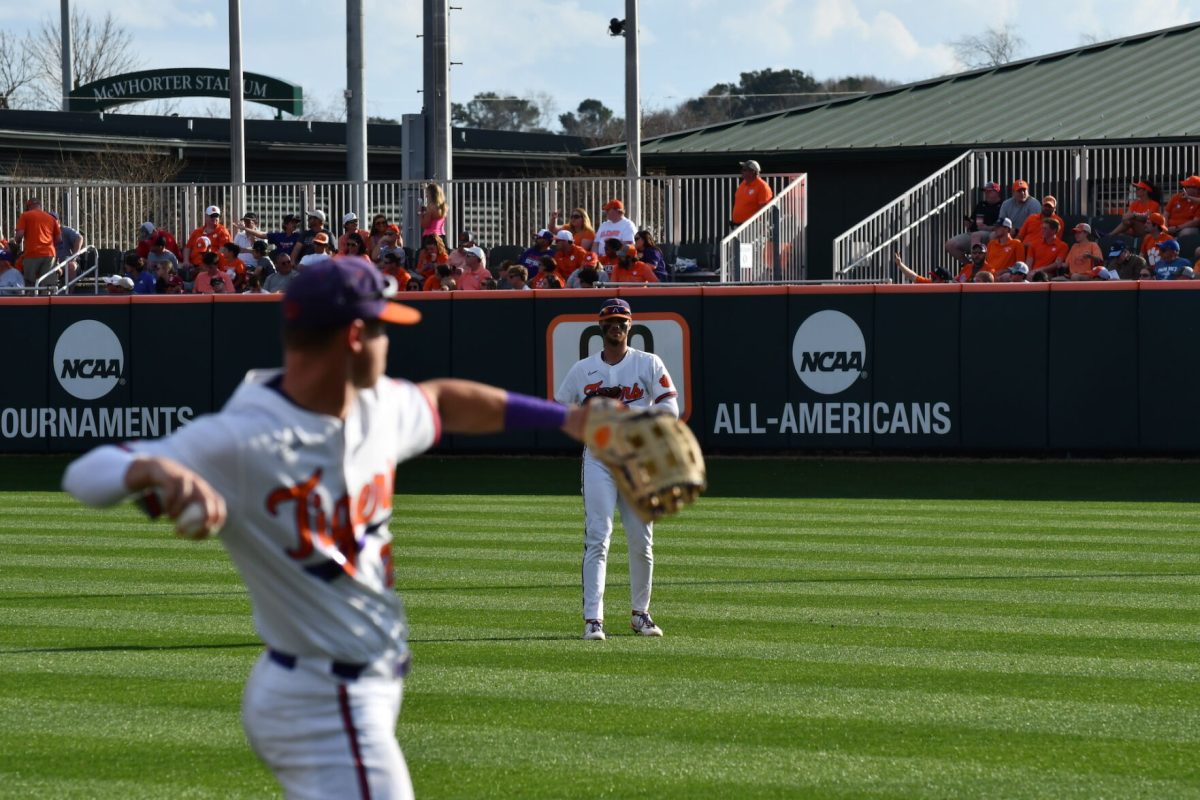 Two+Clemson+baseball+players+throw+the+ball+around+during+a+game+versus+South+Carolina.