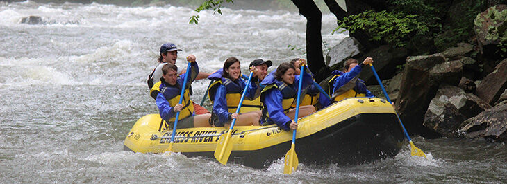 Clemson+students+rowing+down+rapids