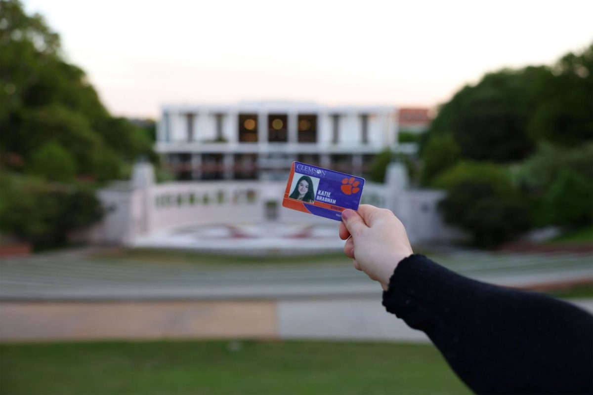 A student ID card in front of the library