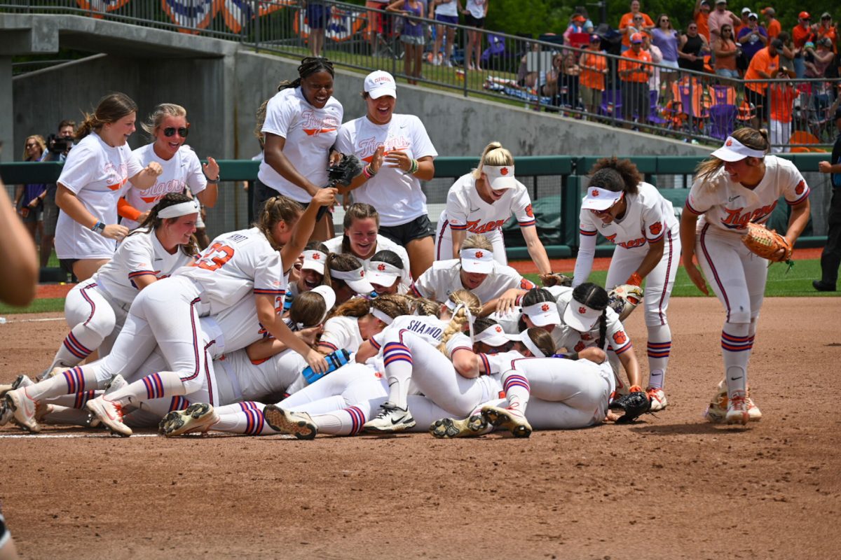 Clemson softball dives into a pile in celebration after the Tigers defeated Louisiana in the Clemson Regional title game to advance to super regionals for the first time in program history.
