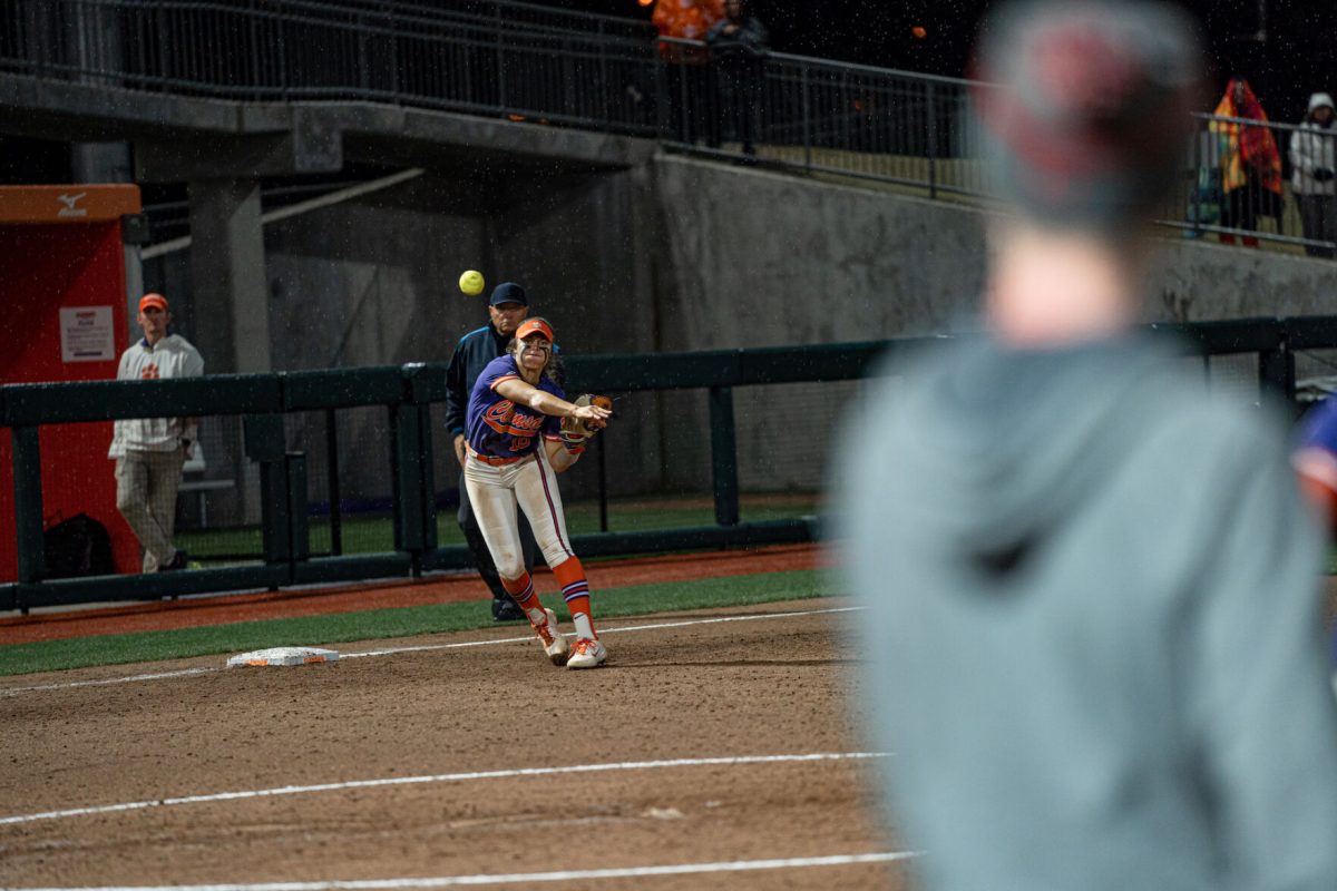 Clemson shortstop Alia Logloleo (16) throws a ball at McWhorter Stadium against Boston. 