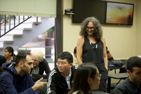 Jennifer Brondell walks international students through activities.