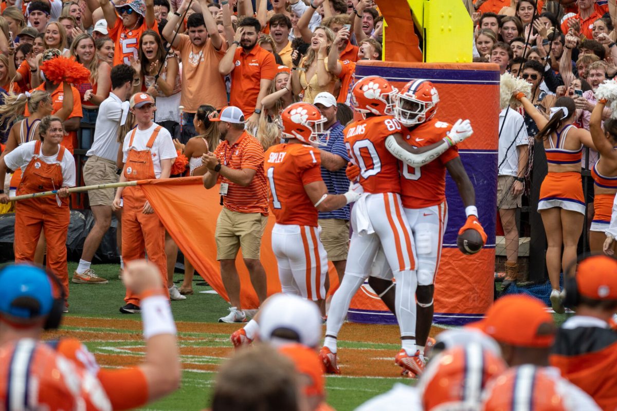 Clemson wide receiver Beaux Collins (80) and running back Will Shipley (1) celebrate with wide receiver Joseph Ngata (10) in the end zone against Furman. 