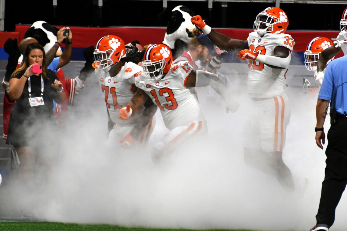 Clemson+defensive+tackle+Tyler+Davis+%2813%29%2C+left+tackle+Jordan+McFadden+%2871%29+and+defensive+tackle+Ruke+Orhorhoro+%2833%29+run+out+of+the+tunnel+at+Mercedes-Benz+Stadium+before+the+Tigers+played+Georgia+Tech+on+Sept.+5%2C+2022.%26%23160%3B