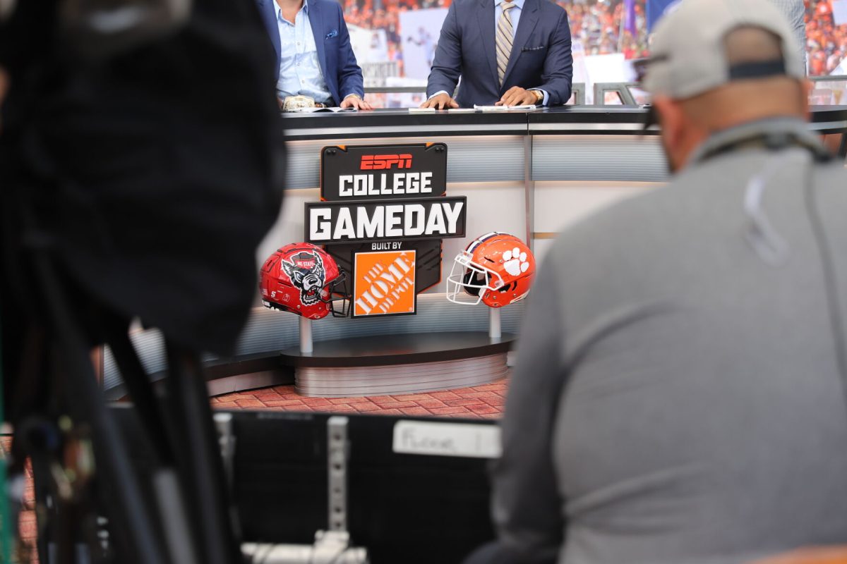 Clemson and NC State helmets sit at the desk of ESPNs College GameDay during its visit to Clemson on Oct. 1, 2022. 