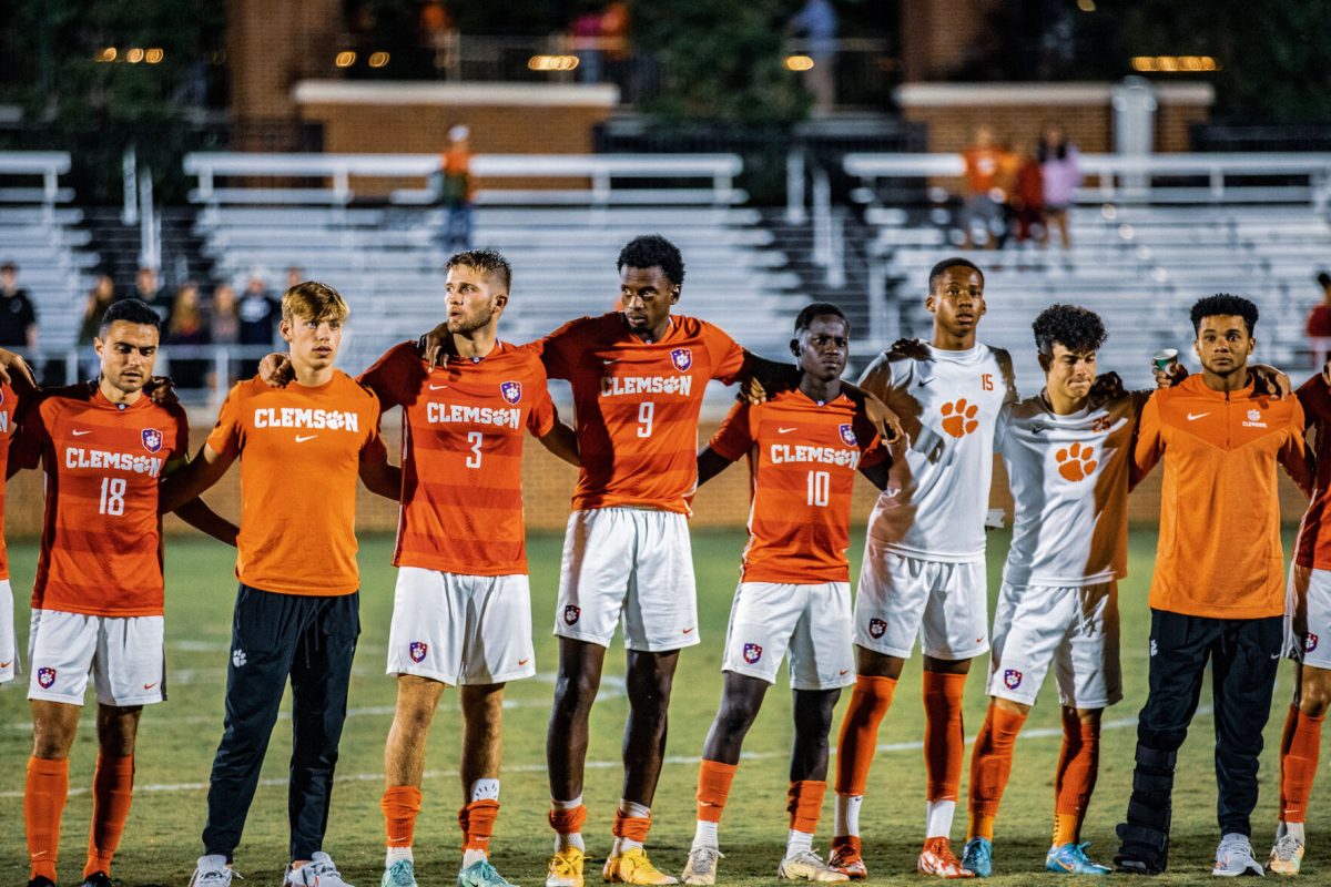 Clemson defender Adam Lundegard (3), forward Mohamed Seye (9) and midfielder Ousmane Sylla (10) standing for the alma mater after the Tigers fell to Wake Forest at Historic Riggs Field on Sept. 24. 