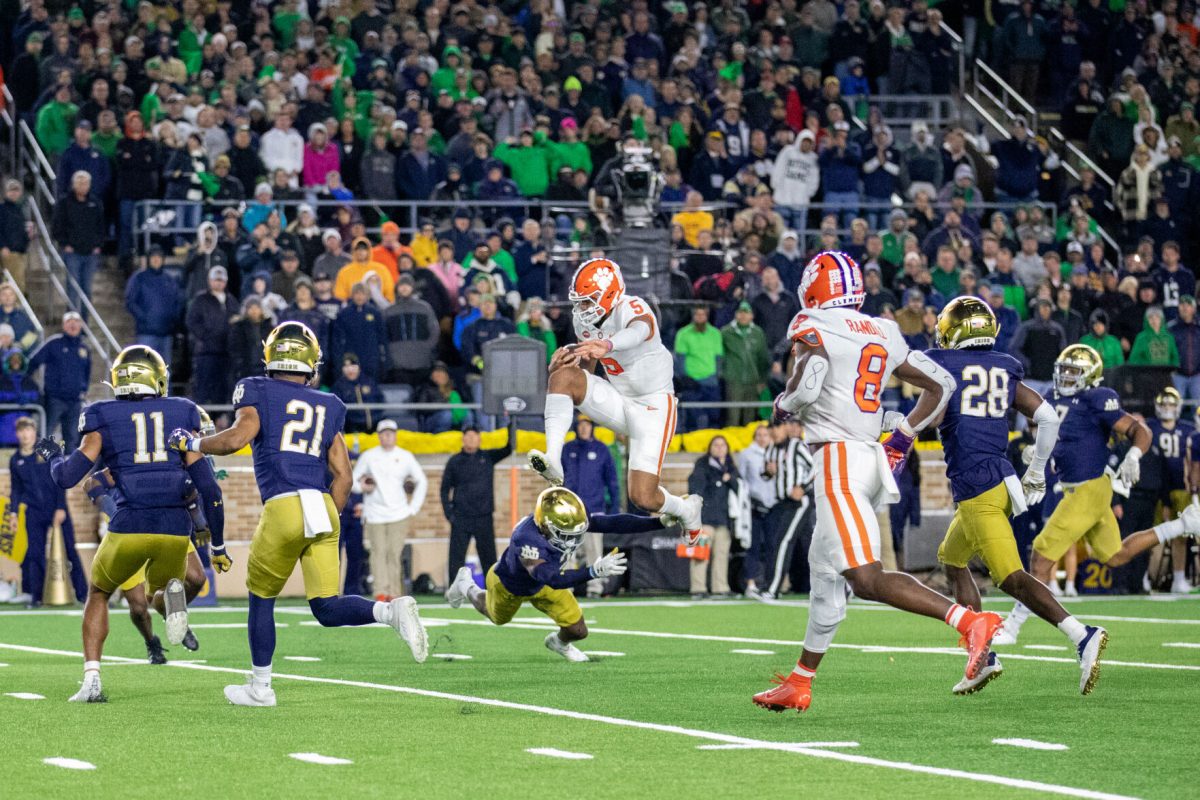 DJ Uiagalelei (#5) jumps over a Notre Dame player in one of the first scoring drives of the game.