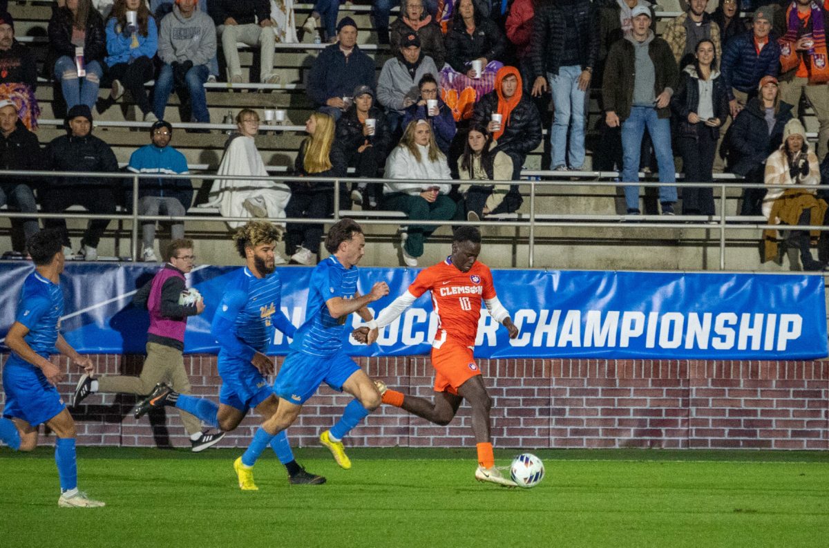 Clemson midfielder Ousmane Sylla dribbles the ball against UCLA at Historic Riggs Field in the second round of the 2022 College Cup on Nov. 20, 2022. 