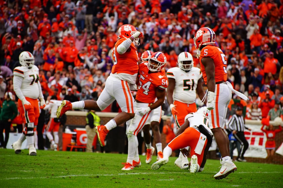 Clemson linebacker Jeremiah Trotter Jr. (54), defensive tackle Tyler Davis (13) and defensive end K.J. Henry (5) celebrate vs. Miami in Memorial Stadium on Nov. 19, 2022.&#160;