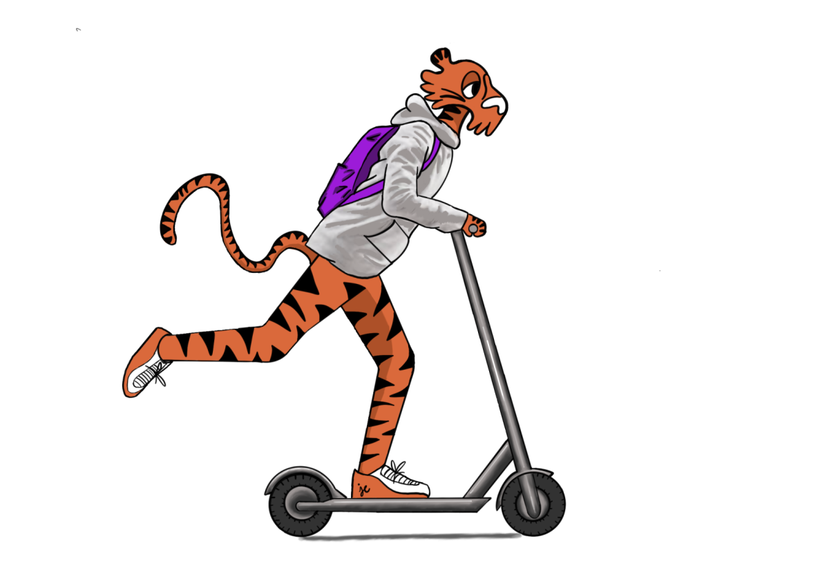Tiger riding on an electric scooter.