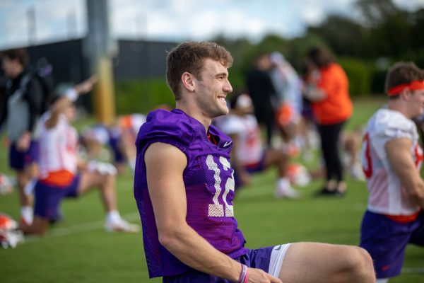 Hunter Johnson (#12) stretches during practice in Miami on Dec. 28, 2022 before the Orange Bowl.