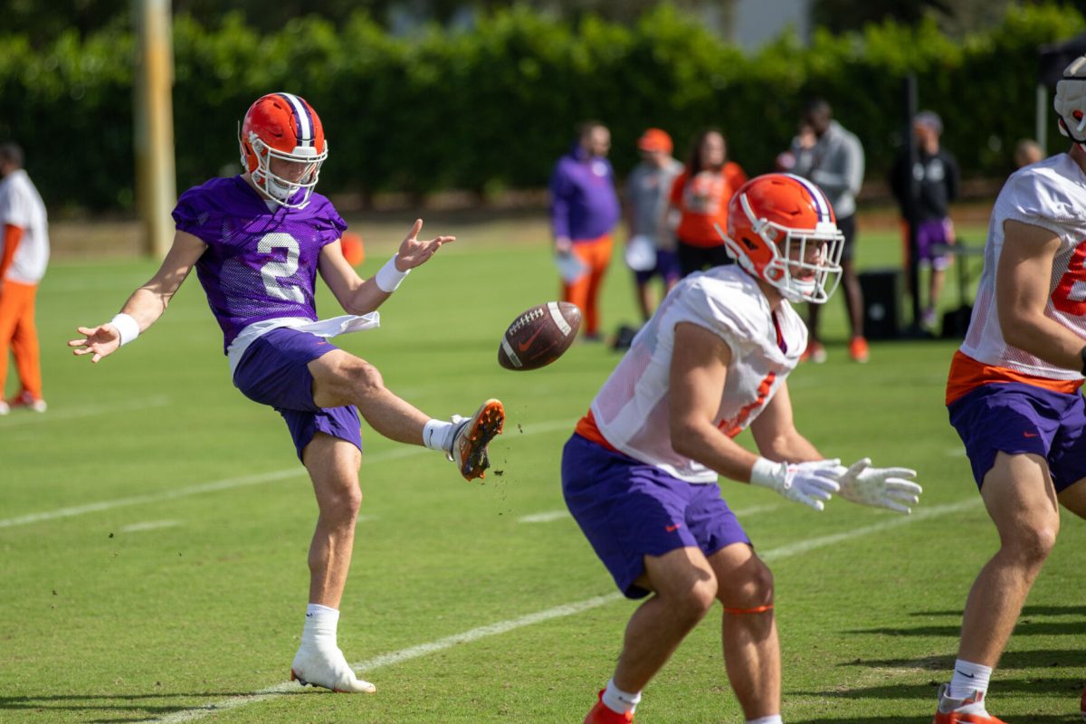 Cade Klubnik (#2) punts a ball during practice in Miami on Dec. 28, 2022 before the Orange Bowl.